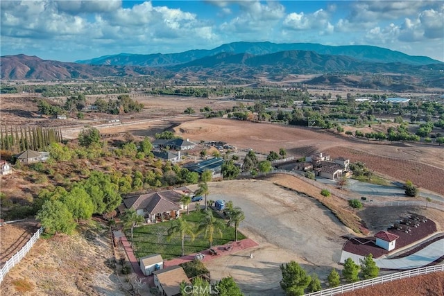 birds eye view of property with a mountain view