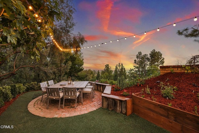 patio terrace at dusk with a lawn