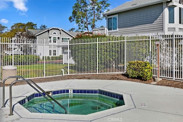 view of pool featuring a yard and a community hot tub