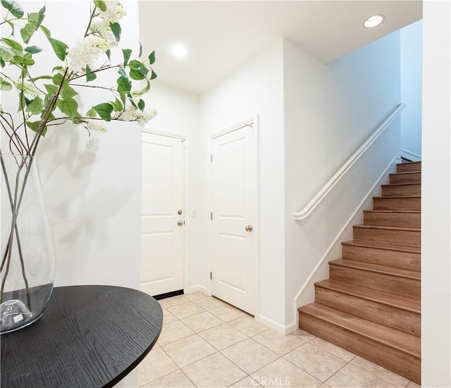 foyer featuring light tile patterned flooring