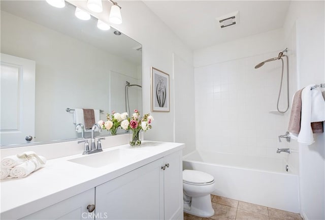 full bathroom with toilet, vanity, tile patterned flooring, and tiled shower / bath combo