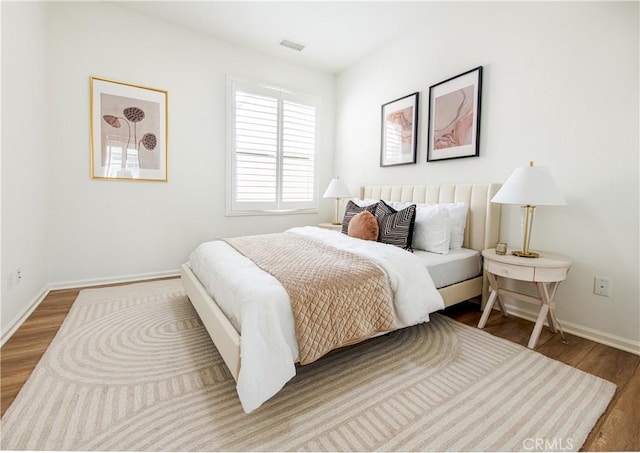 bedroom featuring hardwood / wood-style floors