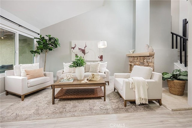 sitting room with lofted ceiling