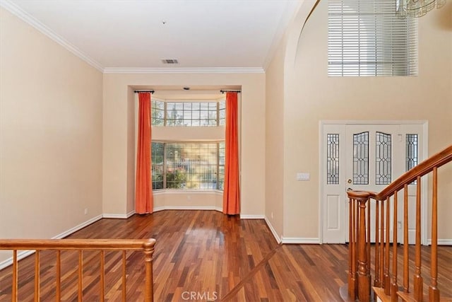 entrance foyer featuring hardwood / wood-style flooring and ornamental molding