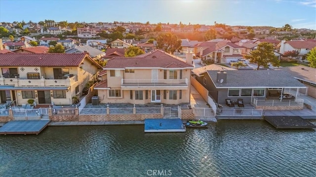 back of house with a water view