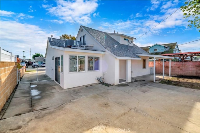 rear view of property with a balcony