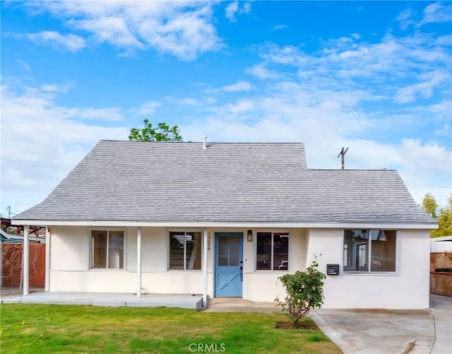 view of front of home featuring a front lawn and a porch