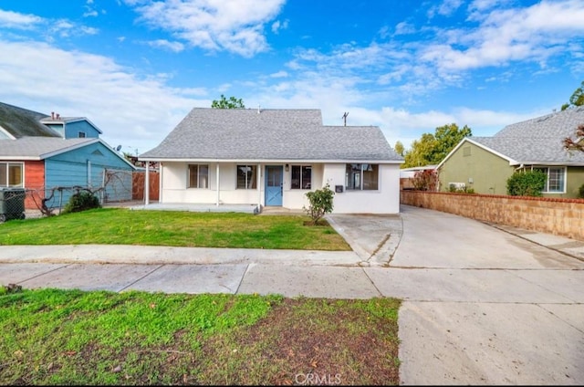 ranch-style home with a porch and a front yard