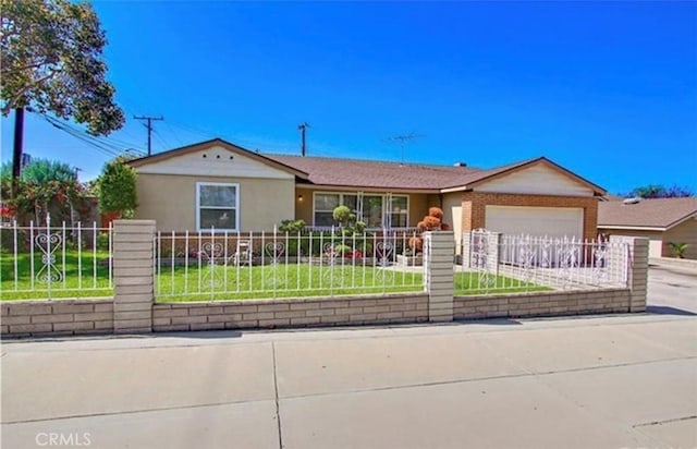 ranch-style home with a garage and a front lawn