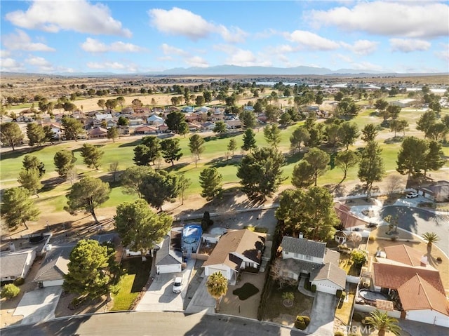 27767 Hummingbird Ln, Helendale, CA 92342 - aerial overview of property's location with a mountain backdrop, nearby suburban area, and a local golf course