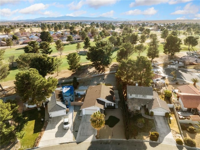 27767 Hummingbird Ln, Helendale, CA 92342 - aerial perspective of suburban area with a local golf course and a mountainous background