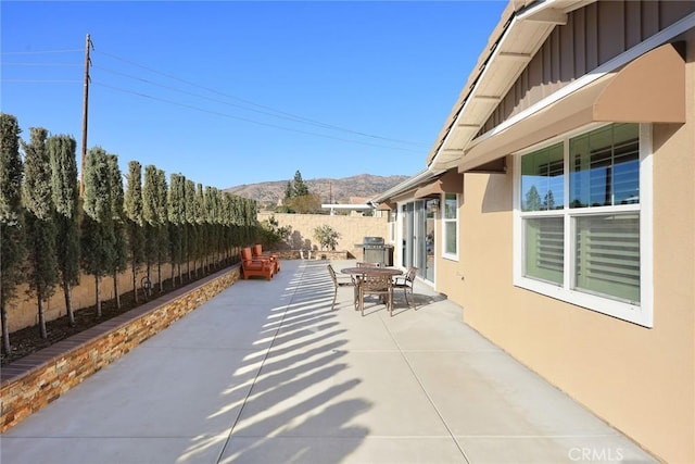 view of patio featuring area for grilling and a mountain view