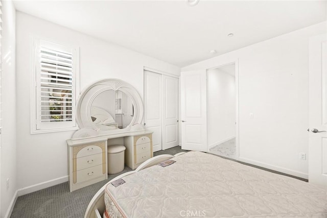 carpeted bedroom featuring a closet