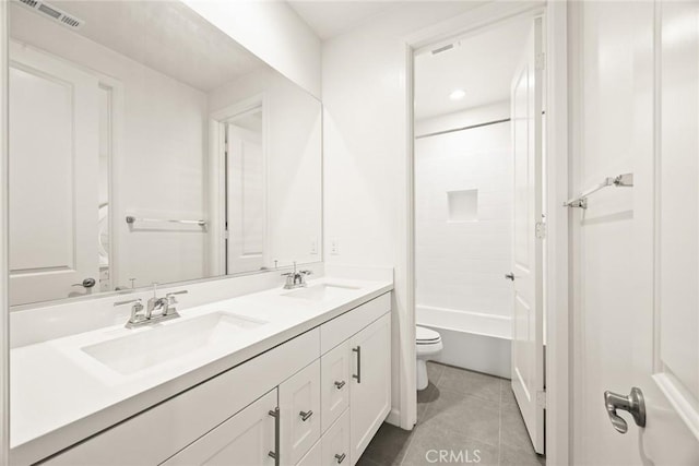 full bathroom with tile patterned flooring, vanity, shower / washtub combination, and toilet