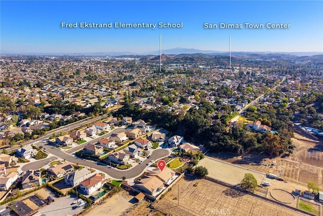 birds eye view of property featuring a mountain view