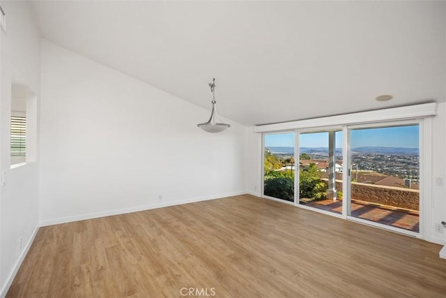 31232 Palma Dr, Laguna Niguel, CA 92677 - unfurnished room with lofted ceiling and light wood finished floors