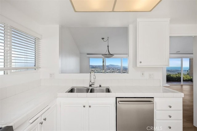 31232 Palma Dr, Laguna Niguel, CA 92677 - kitchen featuring a sink, dishwasher, tile countertops, and plenty of natural light