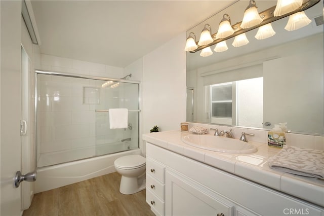 31232 Palma Dr, Laguna Niguel, CA 92677 - bathroom with wood finished floors, vanity, and shower / bath combination with glass door