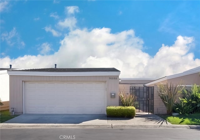 31232 Palma Dr, Laguna Niguel, CA 92677 - view of front of house featuring driveway and a gate