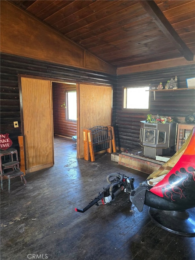 living room with lofted ceiling, a wood stove, wooden ceiling, dark hardwood / wood-style floors, and log walls