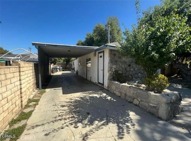 exterior space featuring a carport