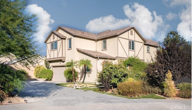 view of side of home with a garage