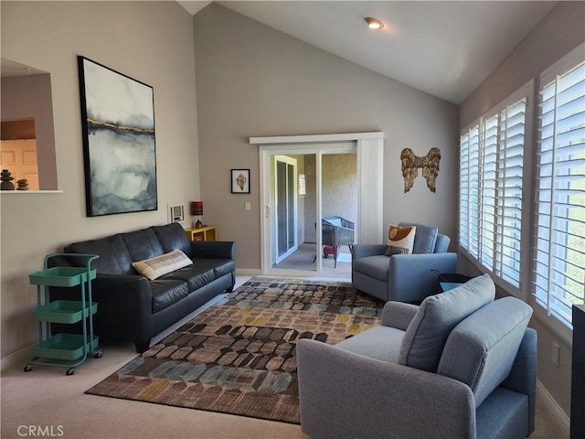 930 Via Mil Cumbres Unit 88, Solana Beach, CA 92075 - carpeted living room featuring healthy amount of natural light, baseboards, and high vaulted ceiling