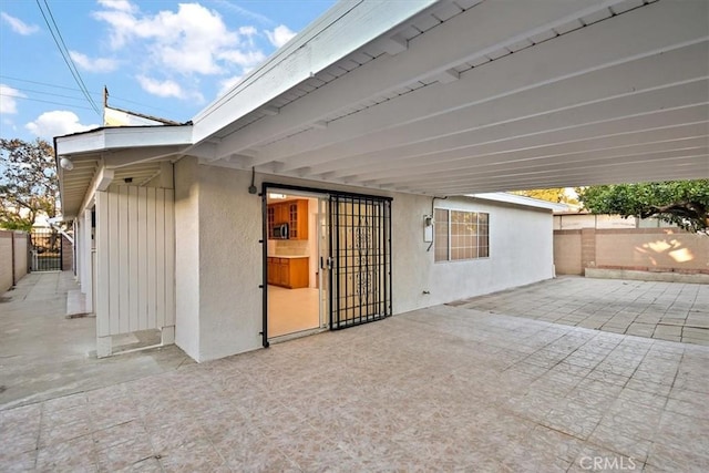 view of patio / terrace featuring a gate and fence