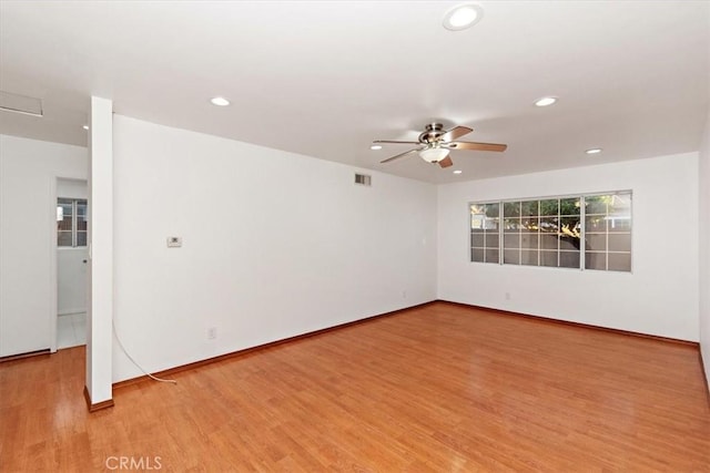 unfurnished room featuring light wood-style flooring, visible vents, a ceiling fan, and recessed lighting