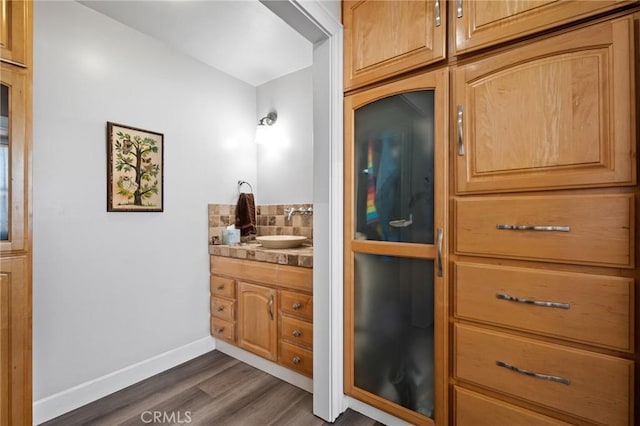 bathroom featuring hardwood / wood-style flooring and vanity