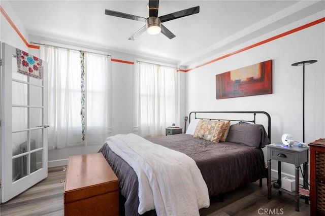 bedroom with hardwood / wood-style floors and ceiling fan