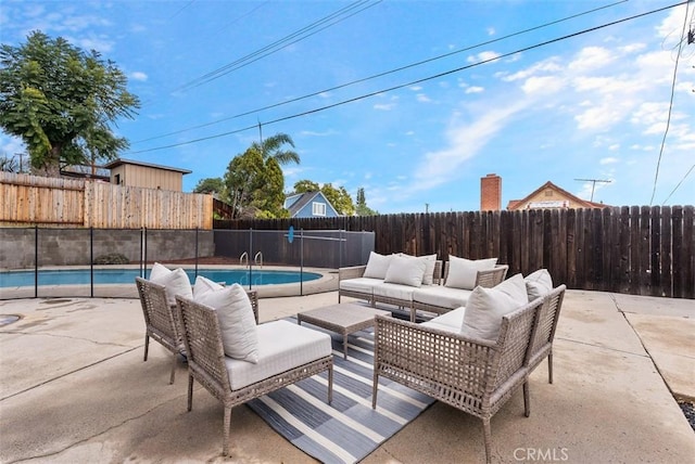 view of patio with a fenced in pool and outdoor lounge area