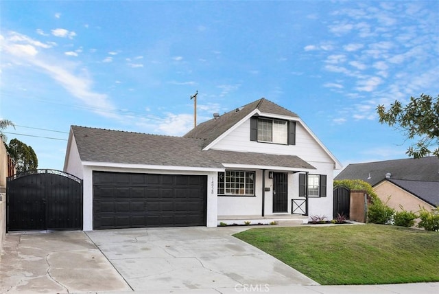 view of front of home featuring a garage and a front yard