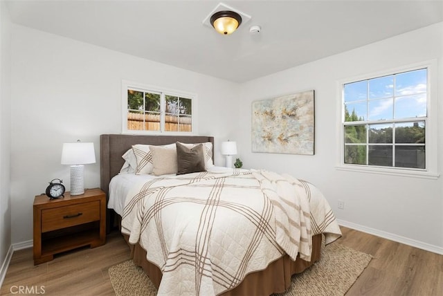 bedroom with light wood-type flooring