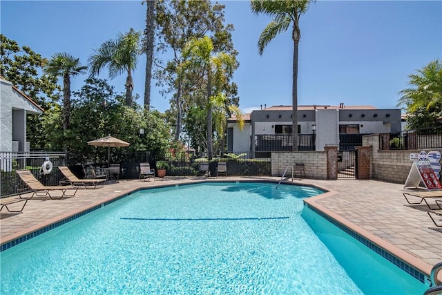 2323 Huntington St Unit 907, Huntington Beach, CA 92648 - pool with fence and a patio area