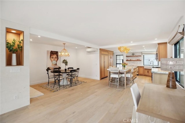 dining area featuring a wall mounted AC, baseboards, light wood-style floors, a notable chandelier, and recessed lighting