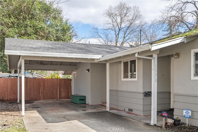 view of vehicle parking with a carport