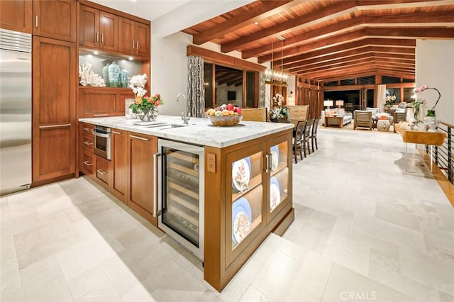 bar featuring beverage cooler, lofted ceiling with beams, stainless steel appliances, wooden ceiling, and hanging light fixtures