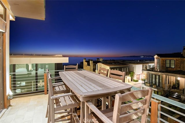 balcony at dusk with a water view