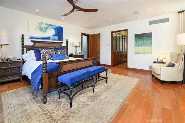 bedroom with ceiling fan and wood-type flooring