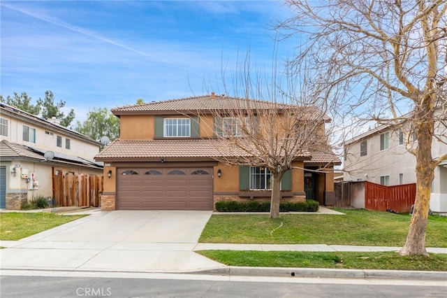 view of front facade with a tiled roof, a front yard, fence, and stucco siding