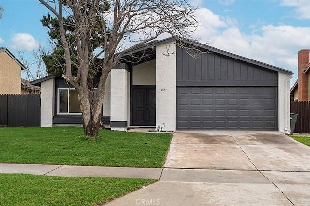 view of front of home with a garage and a front yard