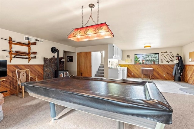 playroom with billiards, light carpet, and wood walls