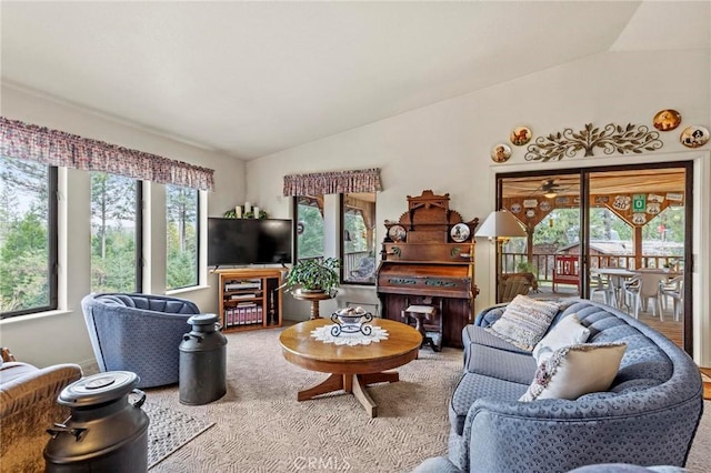 carpeted living room with lofted ceiling