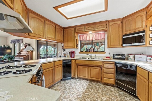 kitchen with white gas stove, dishwasher, and sink