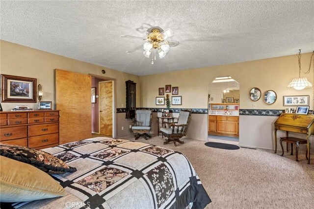 carpeted bedroom featuring a textured ceiling