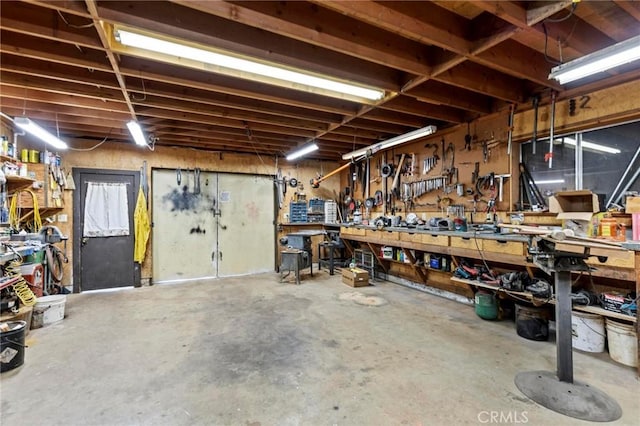 garage with a workshop area