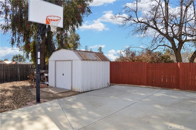 exterior space featuring a fenced backyard and a shed