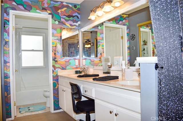 full bath with double vanity and toilet