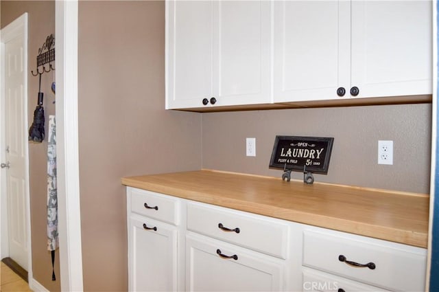 kitchen featuring light countertops and white cabinets